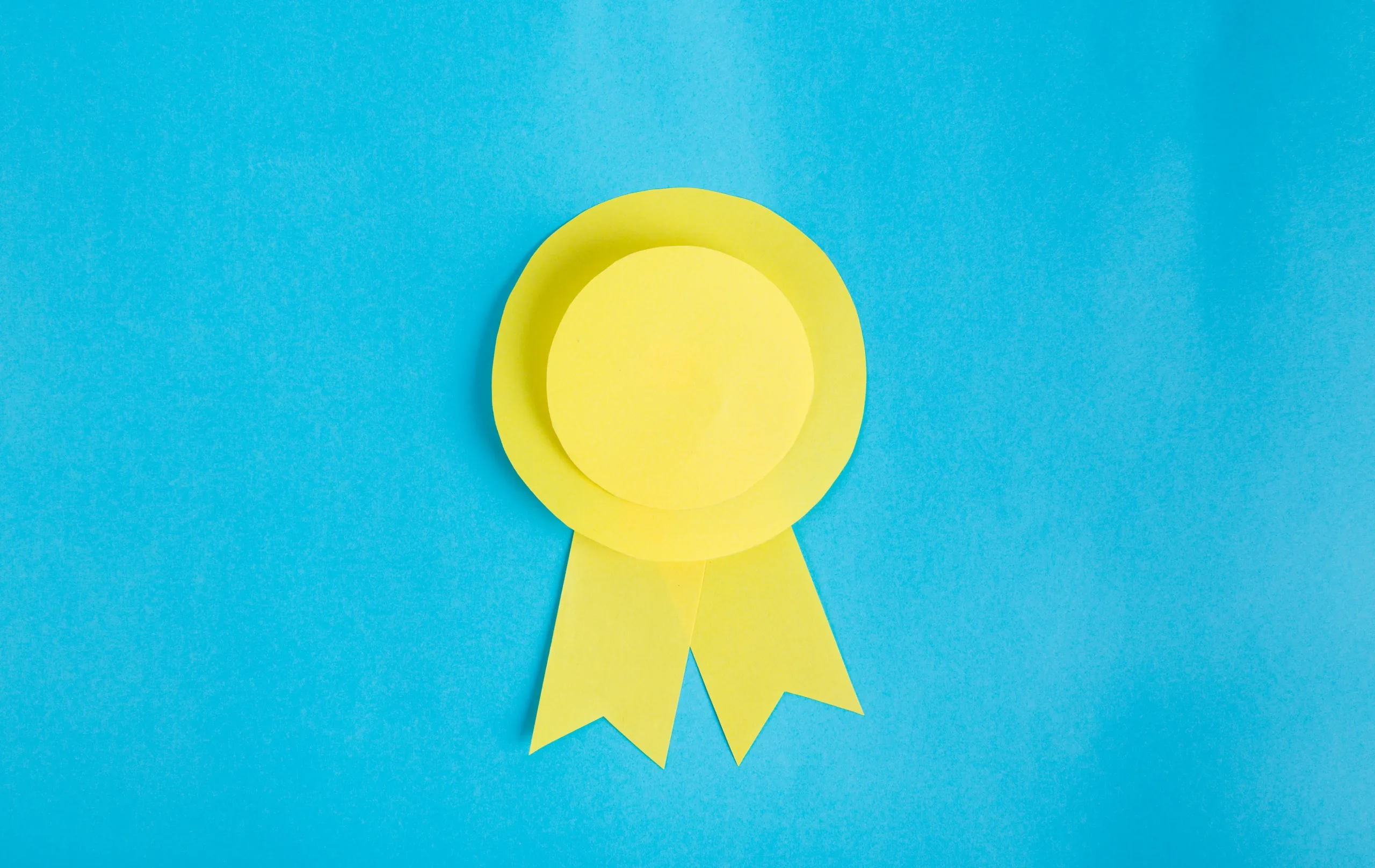Colored paper cutout of award ribbon