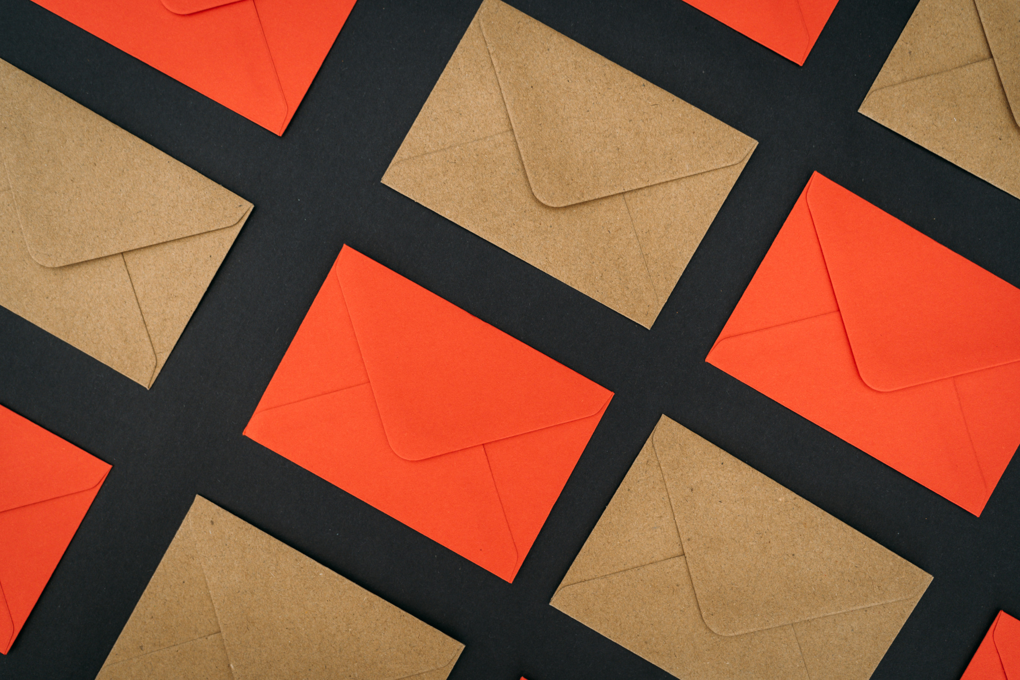 Many brown and red envelopes arranged in a grid pattern